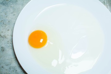 Raw eggs on a plate