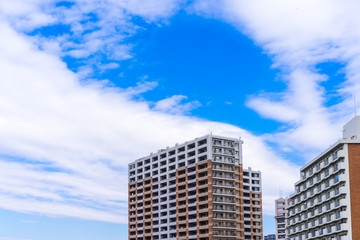 Residence image, apartment building against blue sky