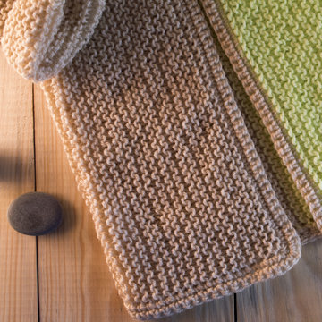 knitted sweater on the wooden background