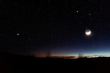Fototapeta na wymiar Night sky with stars and moon in Texas desert / Road trip to Big Bend