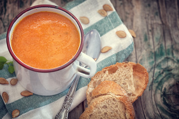 Thanksgiving Pumpkin soup on rustic background 