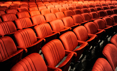 Cinema and music with audience comfortable red seats