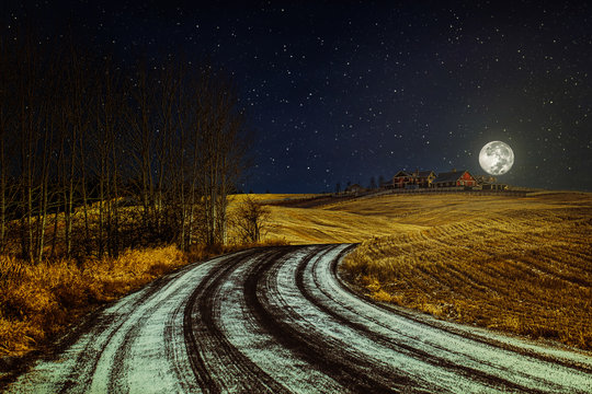 Winter landscape with country road, starry night sky and the moon