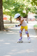 Girl learns to skate on roller skates