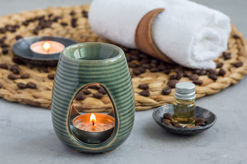 Aroma lamp with coffee essential oil, spa background, horizontal