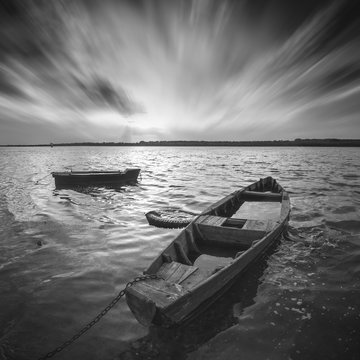 Boats on a river. Monochrome picture