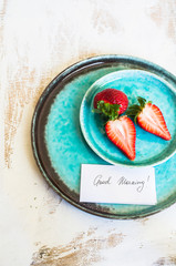 Fototapeta premium Fresh strawberries and good moring note