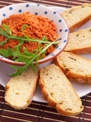 Tomatoes and feta cheese dip with slices of bread. Vertical shot