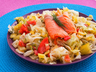 Green salad with tomatoes and smoked salmon. Horizontal shot