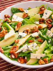 Green salad with avocado, blue cheese, walnuts and pears