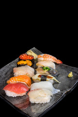 mixed sushi set isolated on black background