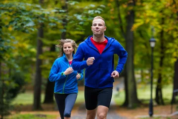 Papier Peint photo Lavable Jogging Woman and man running in park