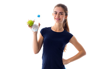 Woman holding apple and water