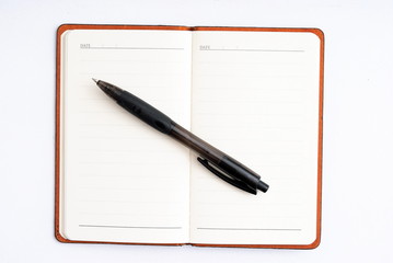 notepad with pen isolated