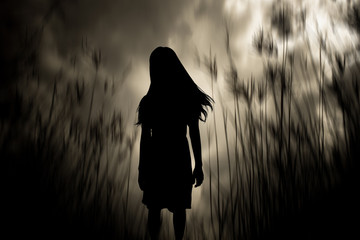 Girl walking in the woods,Horror Background For Halloween Concept And Movie Poster Project