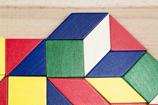 Colorful wooden pieces for tangram technique