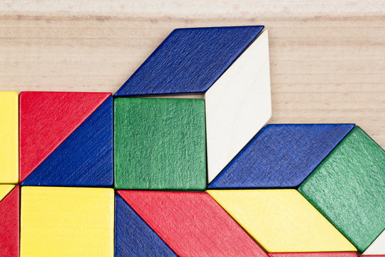 Colorful wooden pieces for tangram technique