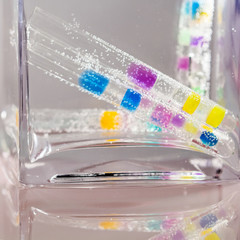 Abstract composition with underwater tubes with colorful jelly balls inside and bubbles