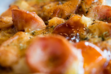 Photo, appetizing pizza with sausage, cheese, tomatoes and mayon