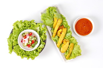 Charcoal boiled pork satay served with Thai cucumber chili sauce 