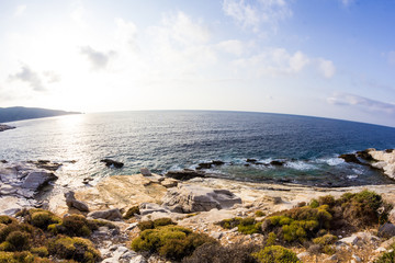 Aegean seashore and marble rocks in Aliki, Thassos island, Greece