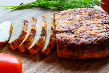 Fried cheese on a wooden base
