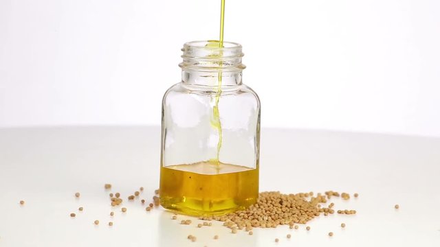 Mustard oil is poured into the bottle