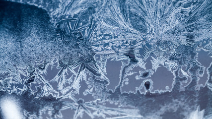 Ice flowers on glass - texture and background