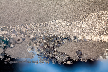 Ice flowers on glass - texture and background
