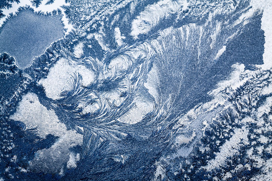 Ice flowers on glass - texture and background