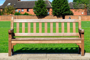 Public wooden bench in a park