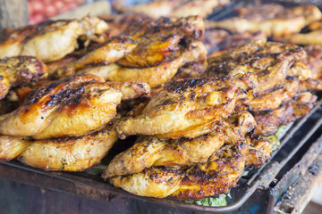 Pile of grilled chicken stall shop by thai style with selective
