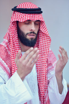 Younger Muslim Arabic man praying