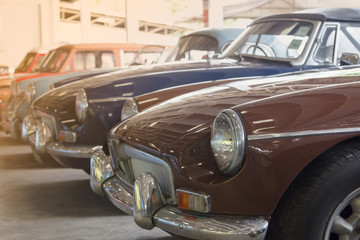 Obraz na płótnie Canvas brown retro and classic car in big garage vintage style