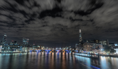 Fototapeta premium Night skyline of London City from the Millennium bridge, London, United Kingdom