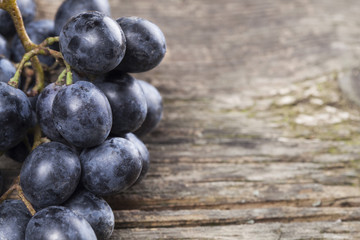 Grapes on old wooden table