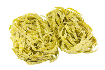 delicious green tagliatelle isolated on white