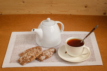 Tea in a white bowl with bread-rings