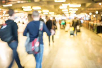 City life, blurred people walking on the airport
