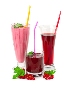 Juices and smoothies made of raspberry, currant, blueberry isolated on white