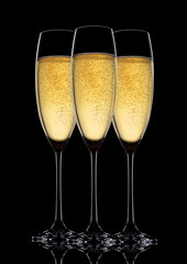 Glasses of sparkling champagne with bubbles black