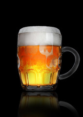 Vintage large glass of beer with foam and bubbles