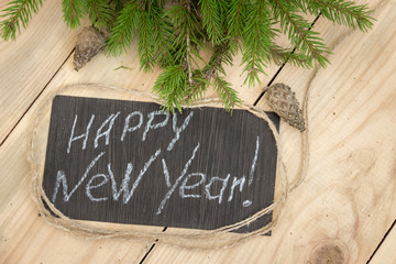 Елочная ветка с рождественскими украшениями. Композиция как фон для поздравительной надписи к Рождеству и Новому году. Международные празднования.