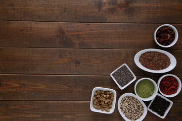 Super Food in bowls on dark wood