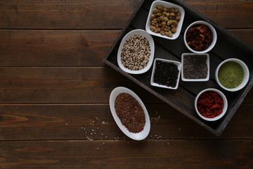 Super Food in bowls on dark wood
