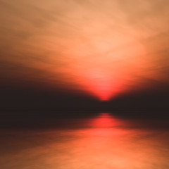 Sun low in horizon over water