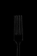 Glowing white contour fork on black background, outline