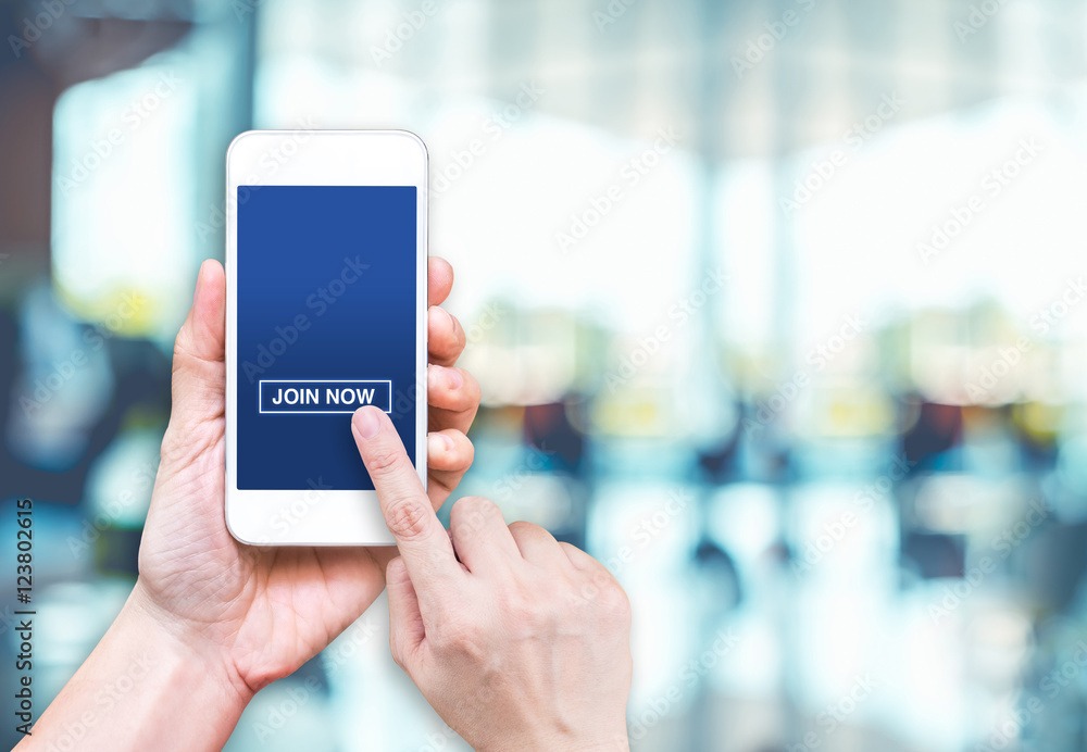 Aufkleber Hand holding mobile  with join now and empty screen for adding y