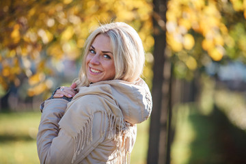 Beautiful girl on a sunny autumn day