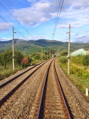 Fototapeta na wymiar Railroad in a beautiful landscape